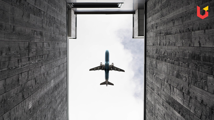 Plane flying over 2 walls of a house (Aviation Management Course)